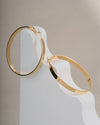 Modern Gold Toned Flat Hoop Earrings