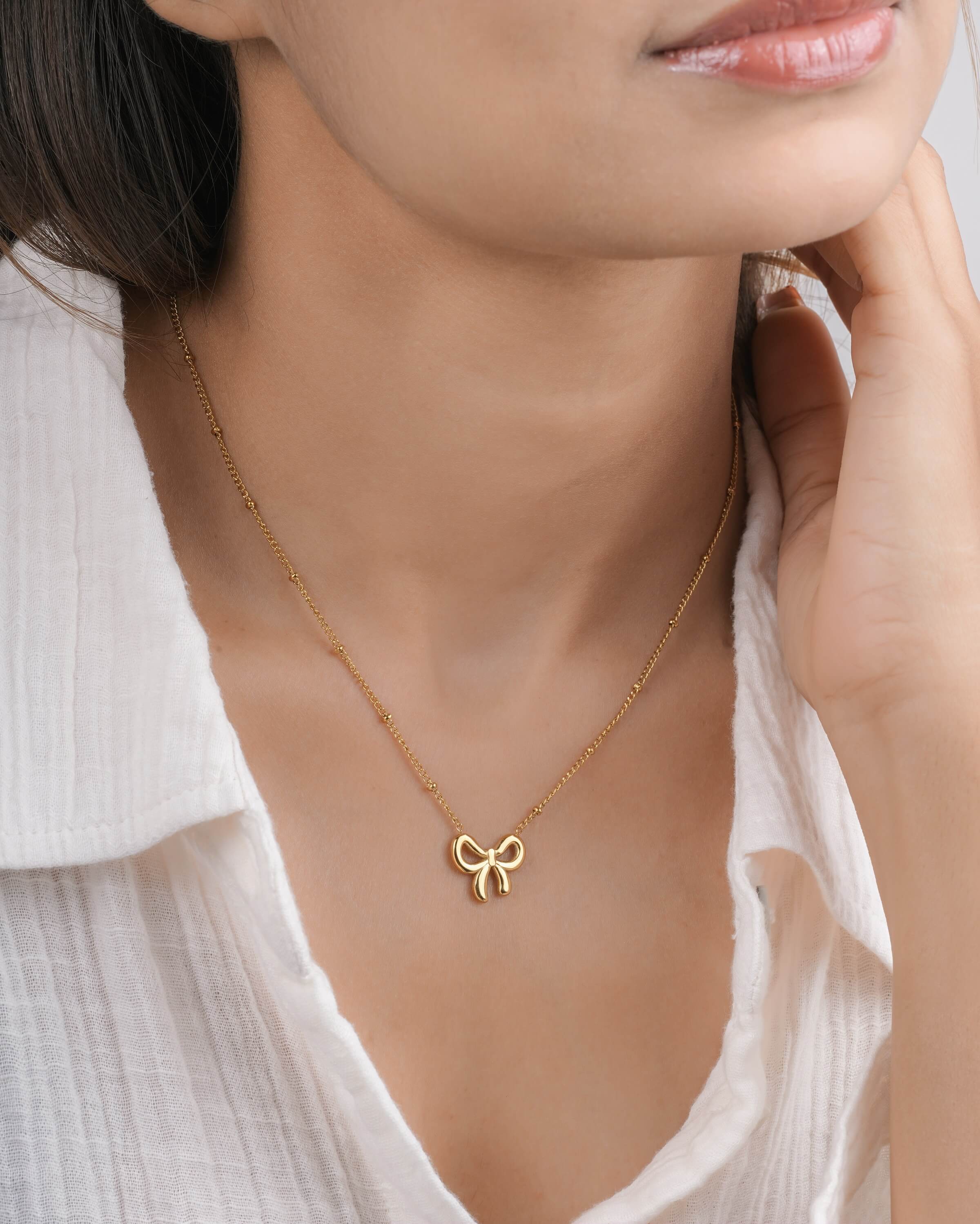 Delicate Gold Tone Bow Pendant Necklace