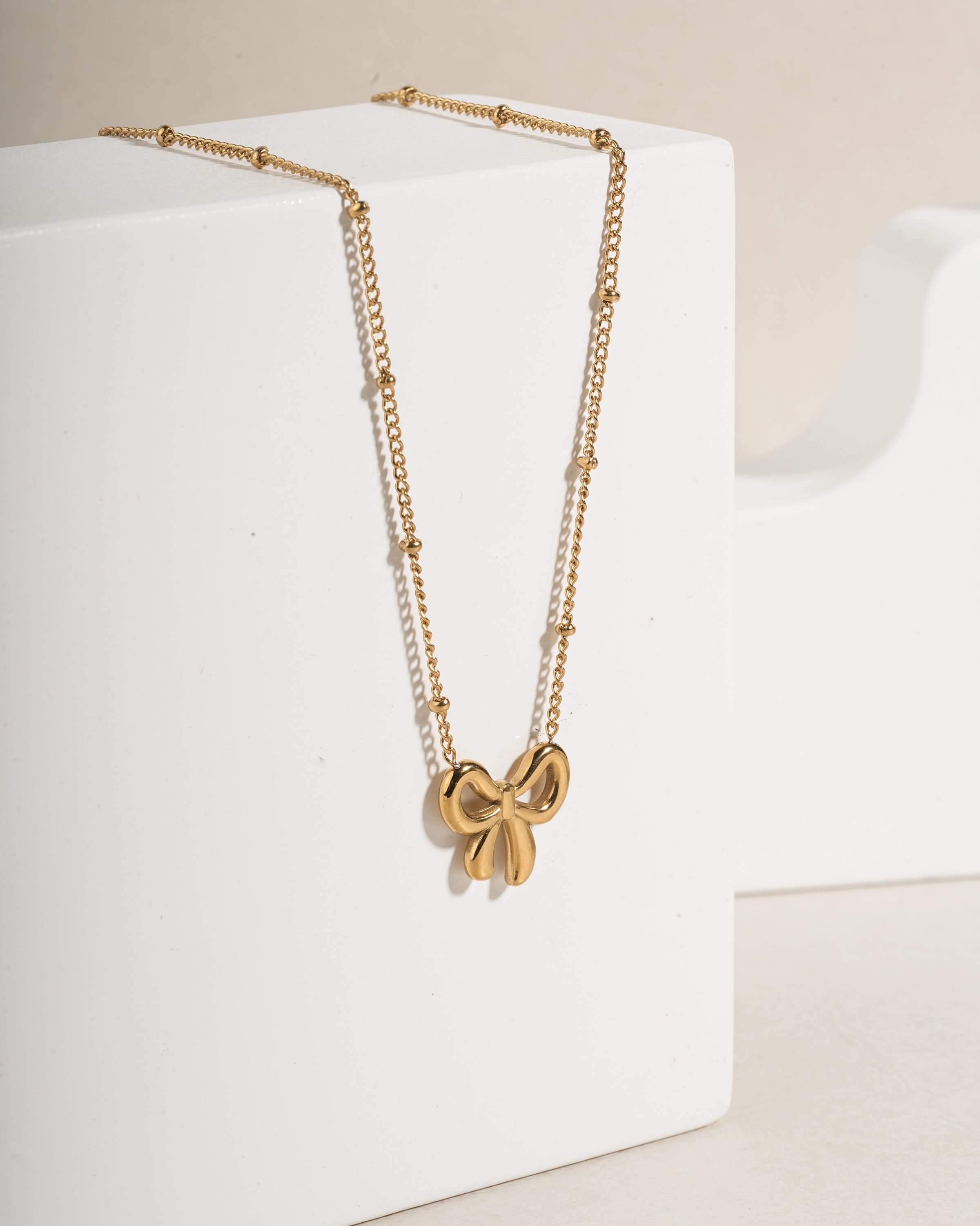 Delicate Gold Tone Bow Pendant Necklace